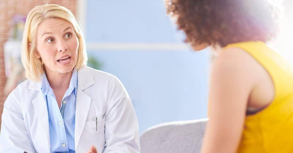 Pharmacy manager having a difficult conversation with an employee about a bad attitude at work