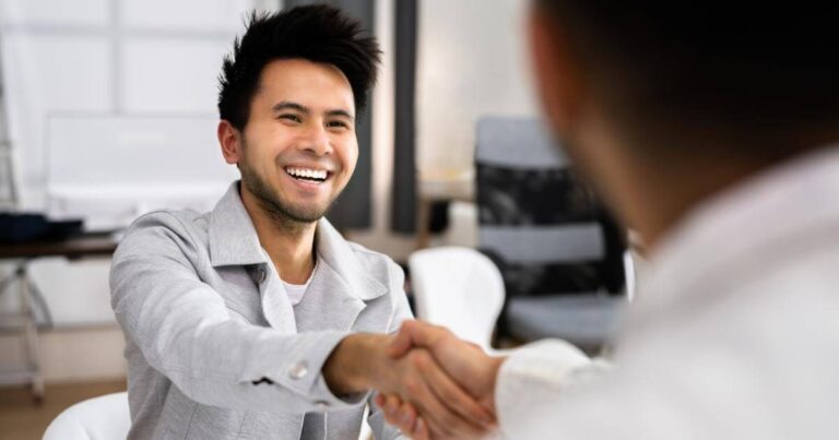 pharmacy candidate shaking hands with recruiter