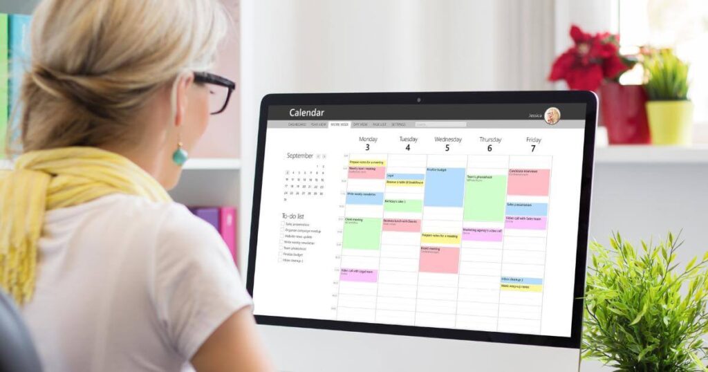 hiring manager looking at work calendar on monitor