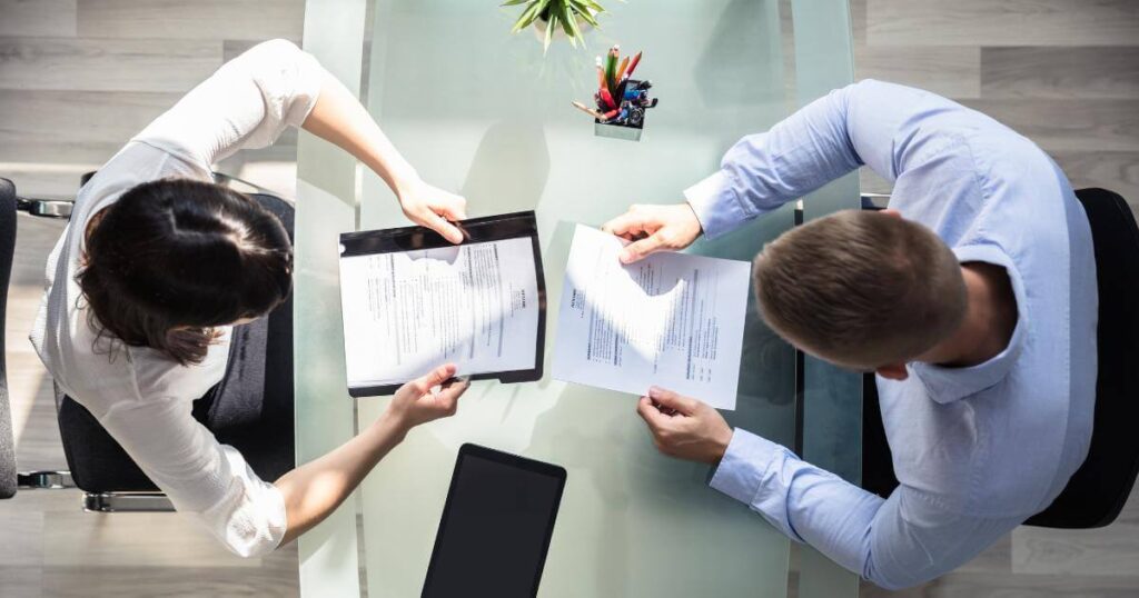 overhead view of HR team looking at resumes