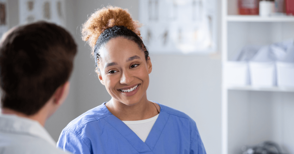 pharmacy techs smiling at pharmacist