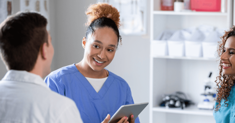 pharmacy techs smiling at pharmacist