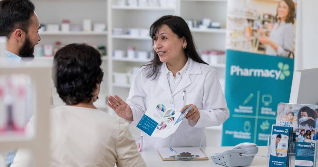 pharmacy employee assisting customers