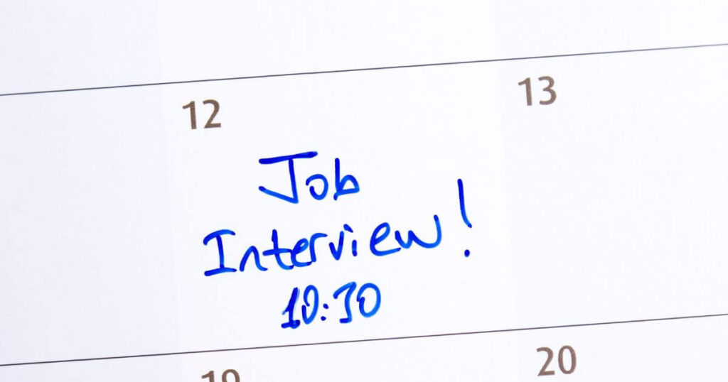 up close image of calendar with text that reads "Job Interview 10:30"